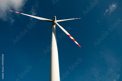 Wind turbine on blue sky