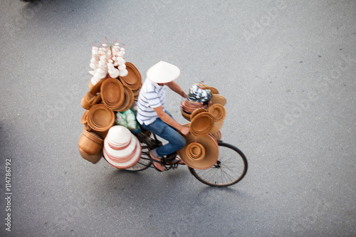 Hanoi, Vietnam, September 30, 2014: Life in Vietnam- Hanoi,Vietnam Street vendors in Hanoi's Old Quarter photo