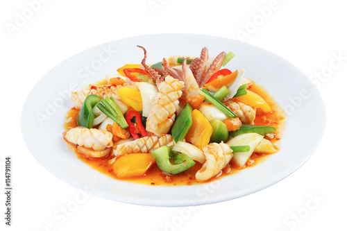 Stir-fried squid with salted egg yolk isolated on white