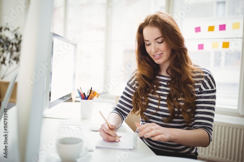 Young businesswoman working in creative office