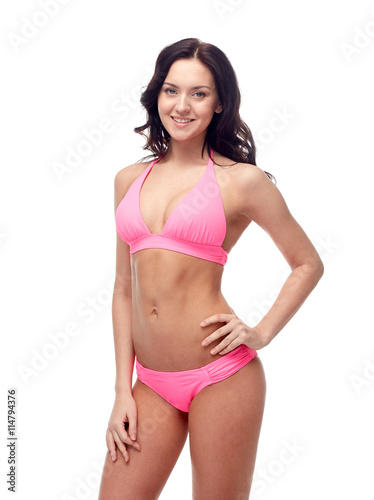 happy young woman in pink bikini swimsuit