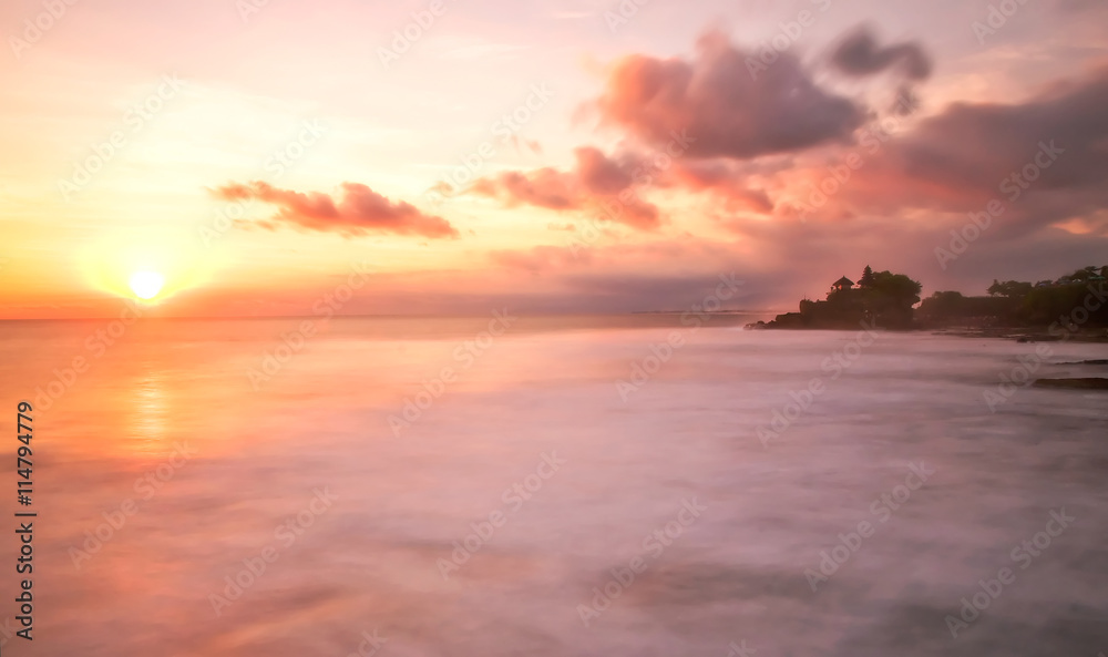 Sunset over Tanah Lot Temple on Sea in Bali Island Indonesia