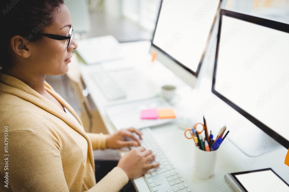 High angle view of businesswoman working in creative office High angle view of businesswoman working in creative office