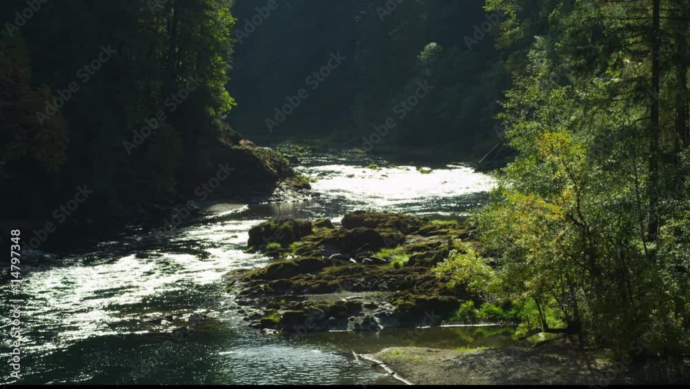 Sunlight on water in the forested North Umpqua River Canyon, Oregon Sunlight on water in the forested North Umpqua River Canyon, Oregon
