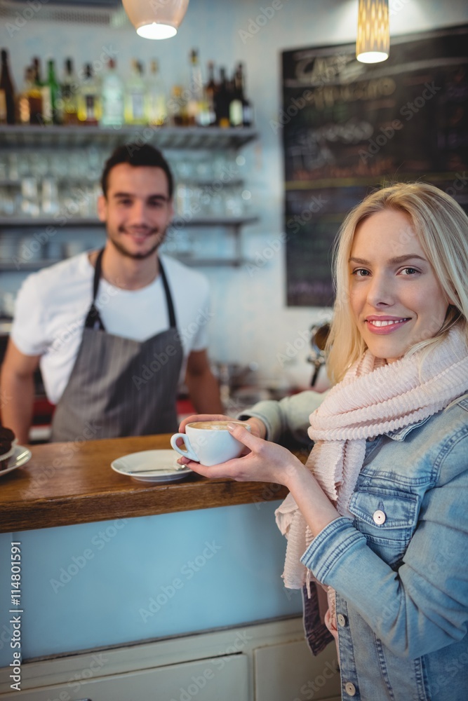 Portrait of female customer with barista at cafe Portrait of female customer with barista at cafe