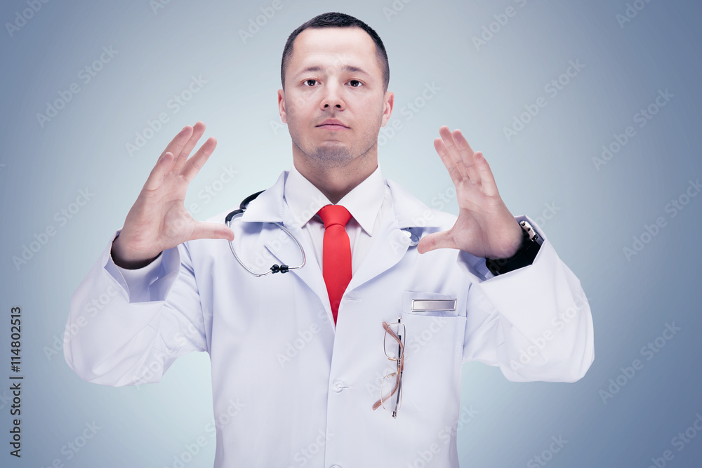 Doctor with stethoscope in a hospital. grey background. High resolution. Doctor with stethoscope in a hospital. grey background. High resolution.