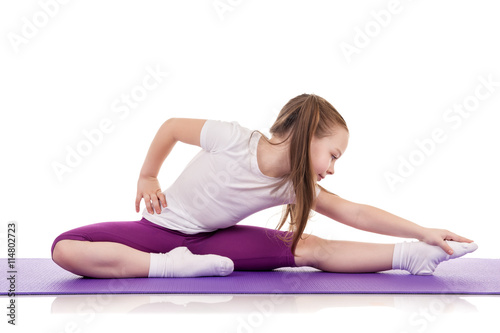 Little girl doing fitness exercises