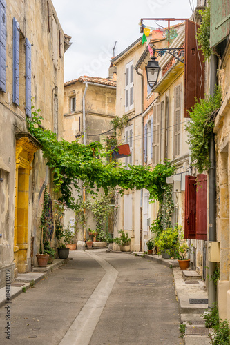 Fototapeta Naklejka Na Ścianę i Meble -  Colourful street in the city of Arles in the Bouches du Rhone