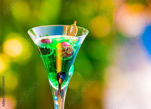 Drink. Absinthe, green background