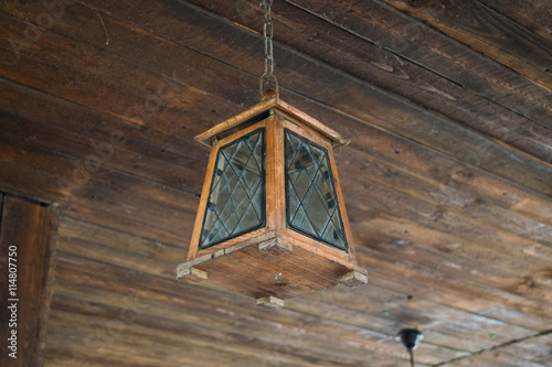 Ceiling lamp on the wooden ceiling