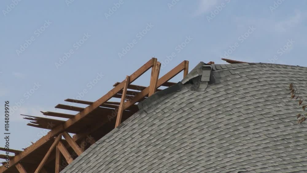 Zoom-out from collapsed roof of building destroyed by a hurricane Zoom-out from collapsed roof of building destroyed by a hurricane