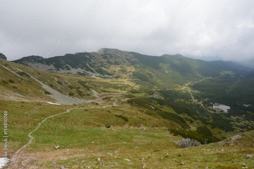 Trail, peaks and clouds in Gasienicowa valley