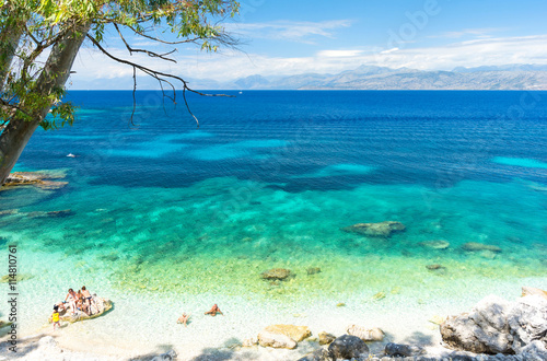 amazing beach with crystal clear water in Kassiopi in Corfu island, Greece