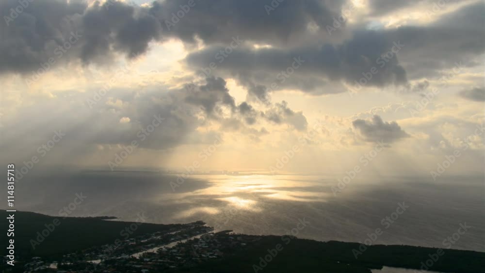 Slow flight along Florida coastline near Miami, evening rays gleaming on water Slow flight along Florida coastline near Miami, evening rays gleaming on water