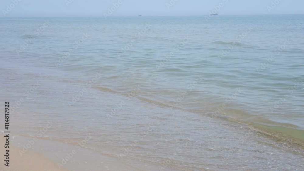 Soft crashing of waves on the beach at seaside Soft crashing of waves on the beach at seaside