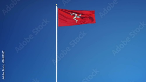 Isle of Man flag waving in slow motion against blue sky, seamlessly looped, long shot, isolated on alpha channel with black and white luminance matte, perfect for film, news, digital composition photo