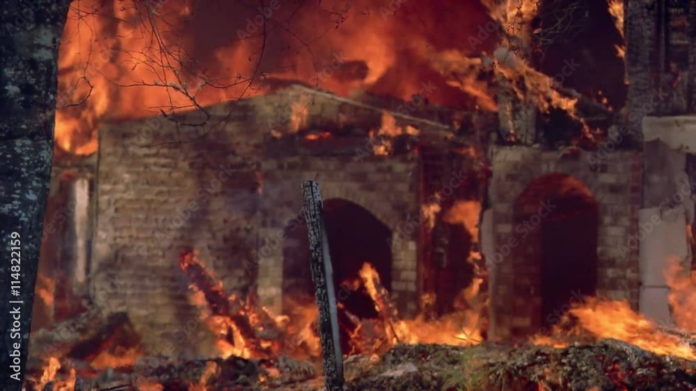 Brick arches standing amidst blazing structure fire Brick arches standing amidst blazing structure fire