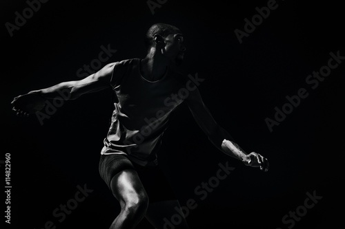 Composite image of athlete man throwing a discus photo