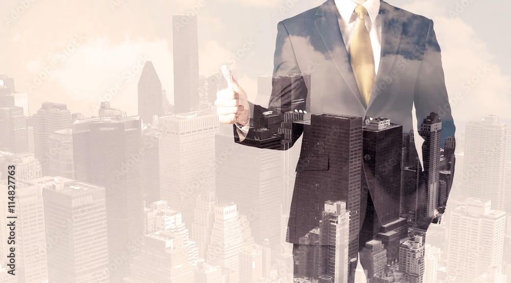 Handsome business man with overlay cityscape Handsome business man with overlay cityscape