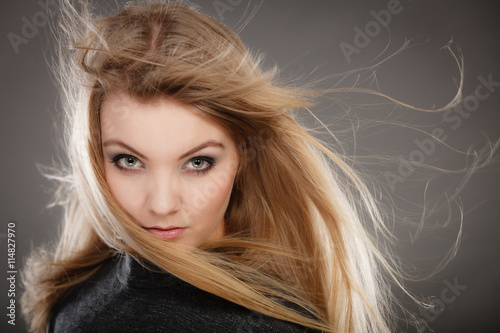 Gorgeous blonde woman with open waving hair.