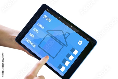 Composite image of finger pointing to tablet