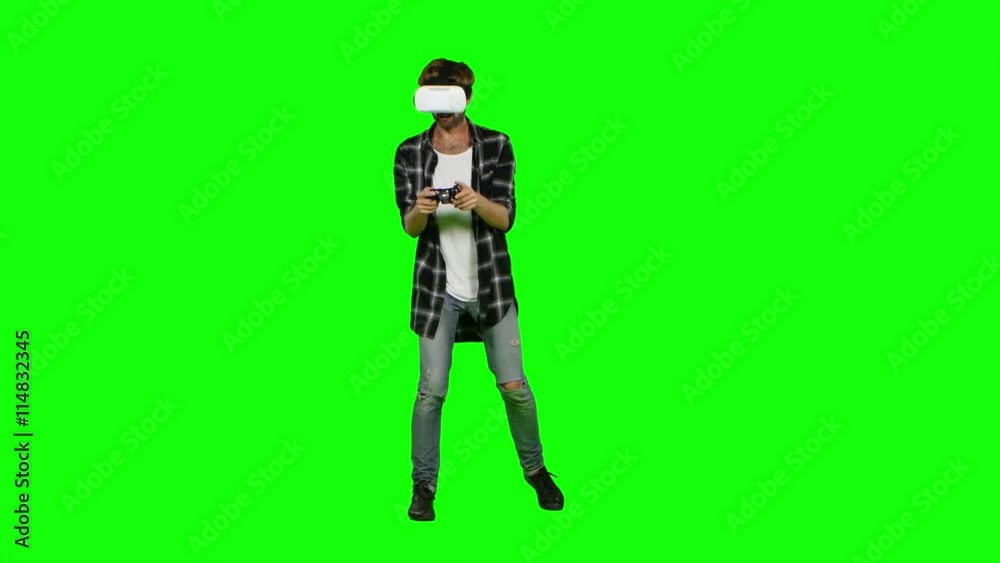 Man in virtual reality glasses and with joystick. Green screen Man in virtual reality glasses and with joystick. Green screen