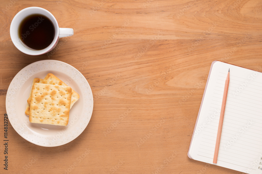 Mobile phone, notebook, pencil, coffee, tea, food cracker Mobile phone, notebook, pencil, coffee, tea, food cracker