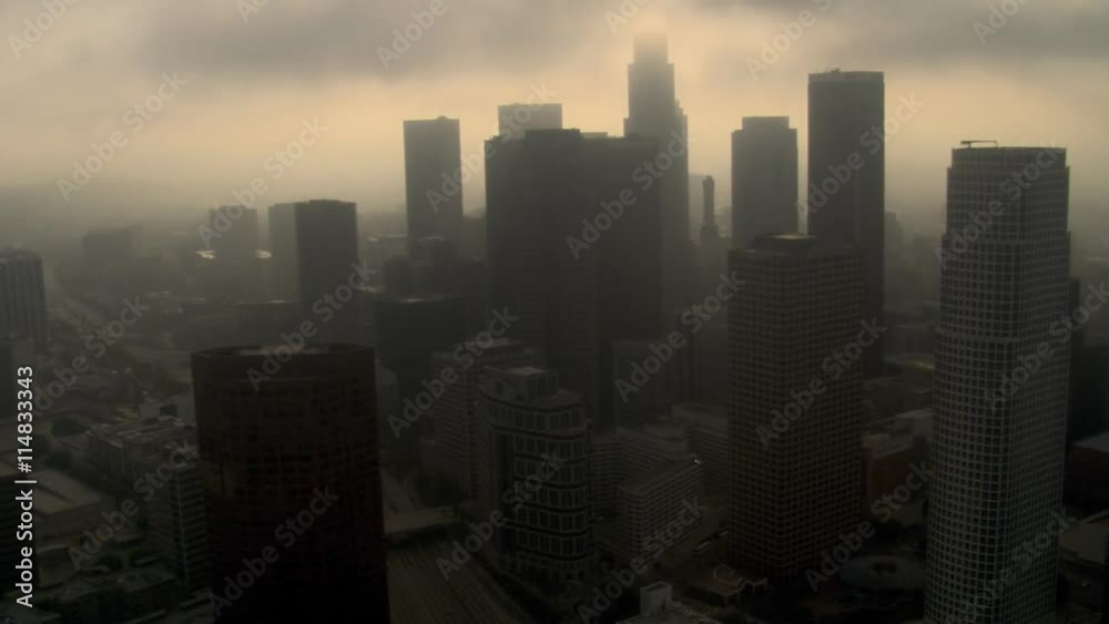 Orbiting downtown Los Angeles with smog and overcast skies. Shot in 2008.