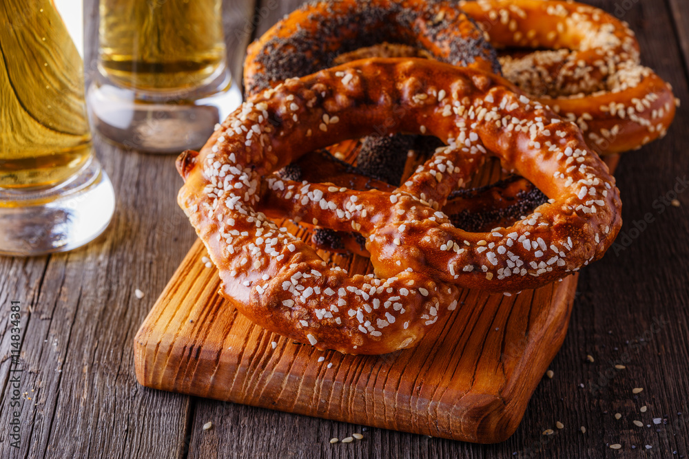 Pretzels and beer on a wooden background. Pretzels and beer on a wooden background.