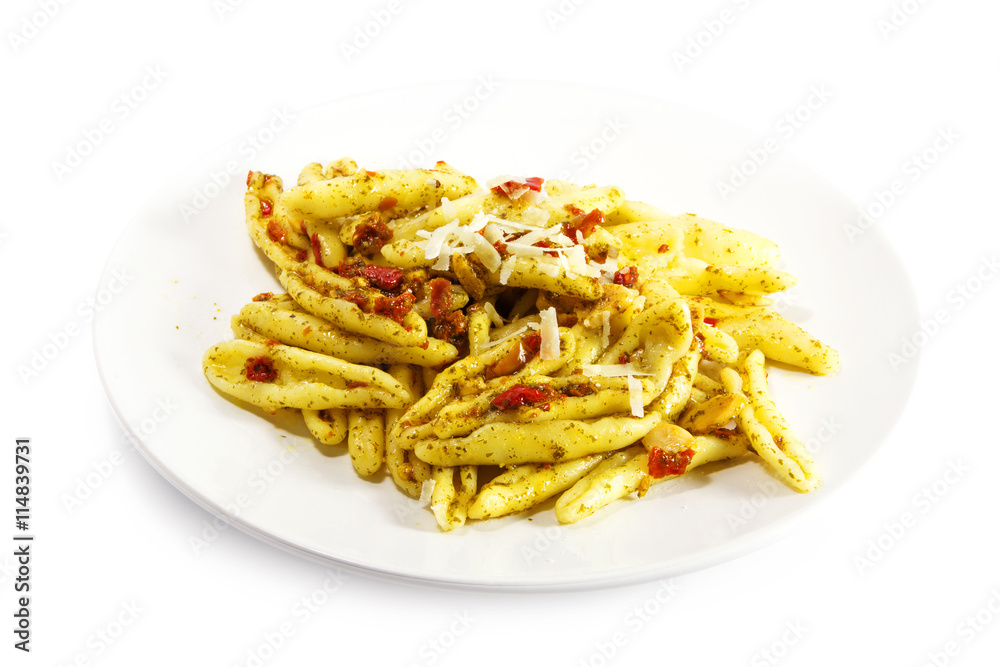 pasta variety called capunti with garlic and oil, pickled tomatoes and parmesan cheese, isolated on white pasta variety called capunti with garlic and oil, pickled tomatoes and parmesan cheese, isolated on white