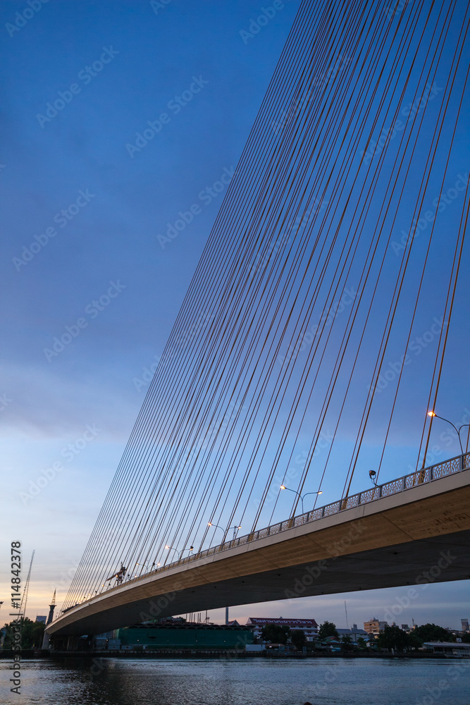 Fototapeta premium Rama 8 Bridge at sunrise in Bangkok and Chopraya river, Thailand