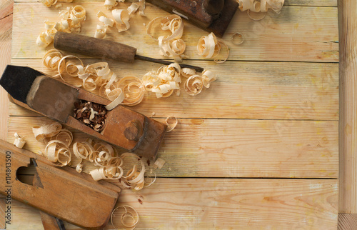 Carpenter tools on wood table background. Top view. Copy space