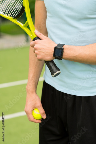 Young guy playing tennis on court © Yakobchuk Olena