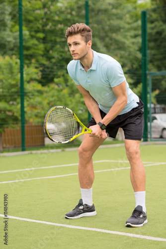 Skillful young tennis player ready to beat ball © Yakobchuk Olena