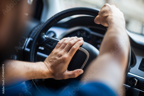 Hands on steering wheel, honking photo