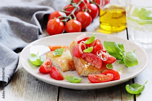 Bruschetta with tomatoes,shallot and basil. Selective focus