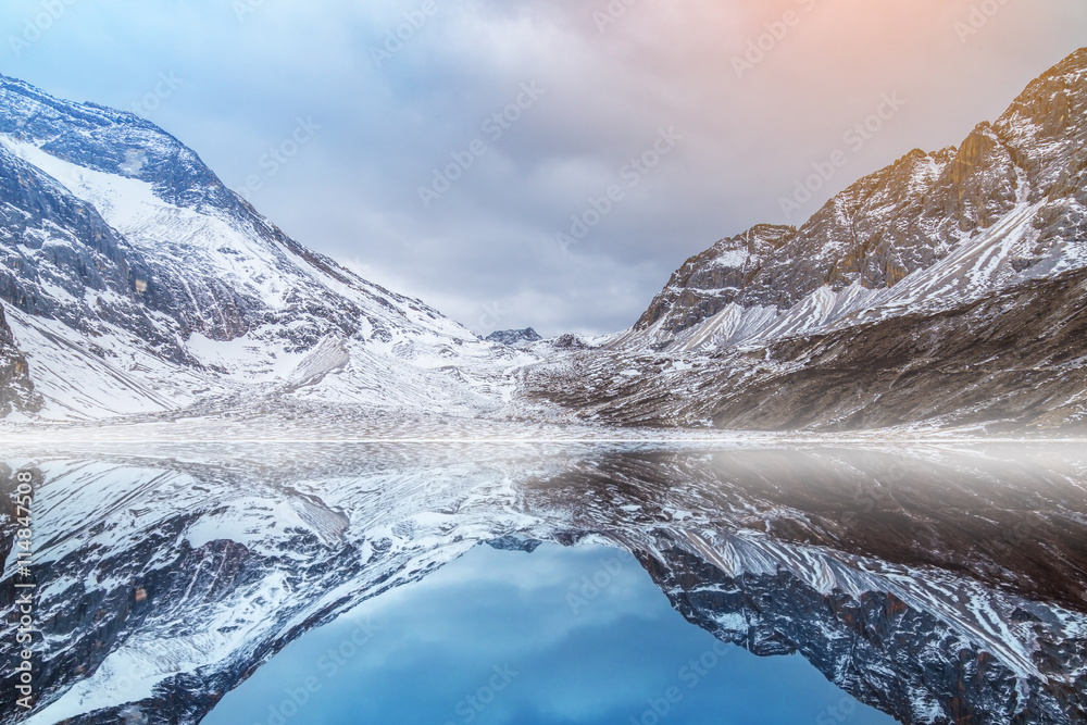 Obraz premium reflection of snow mountain in Yading China