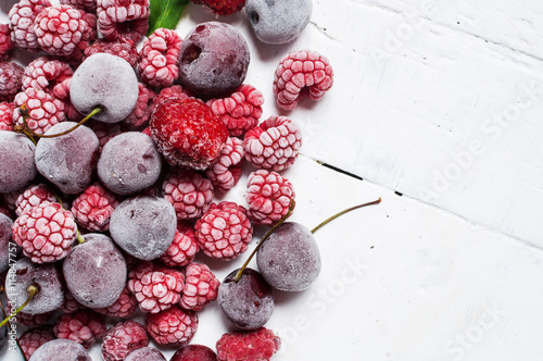 Summer fresh berries, healthy food, white wooden background. photo