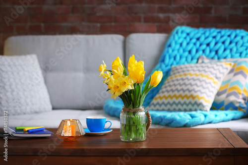 Beautiful interior with yellow flowers of living room