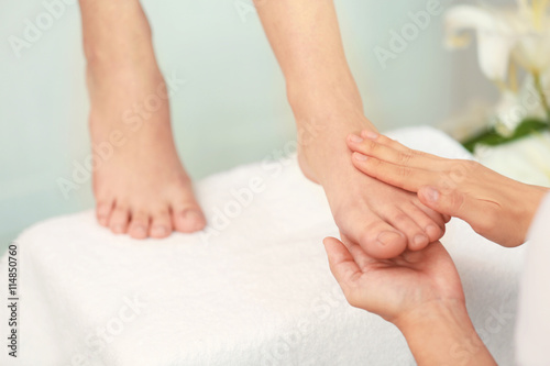 Woman having spa massage on her feet at beauty salon © Africa Studio