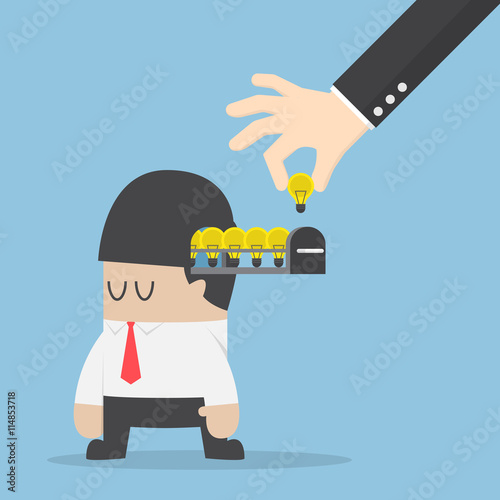 Hand pick up light bulb of idea from businessman head