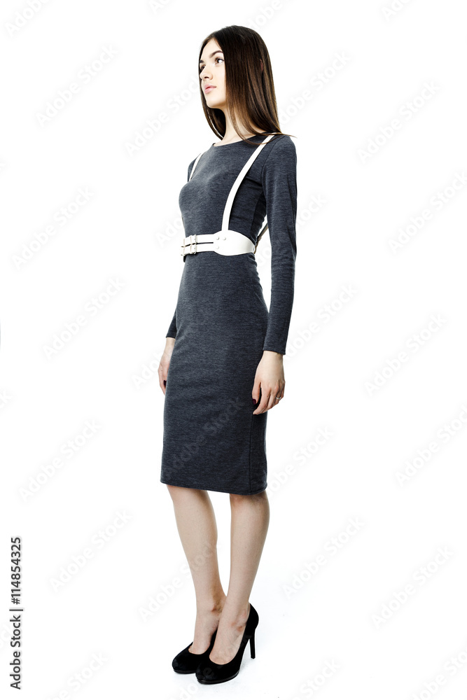 Attractive beautiful dark-haired woman wearing dress and belt on white background Attractive beautiful dark-haired woman wearing dress and belt on white background