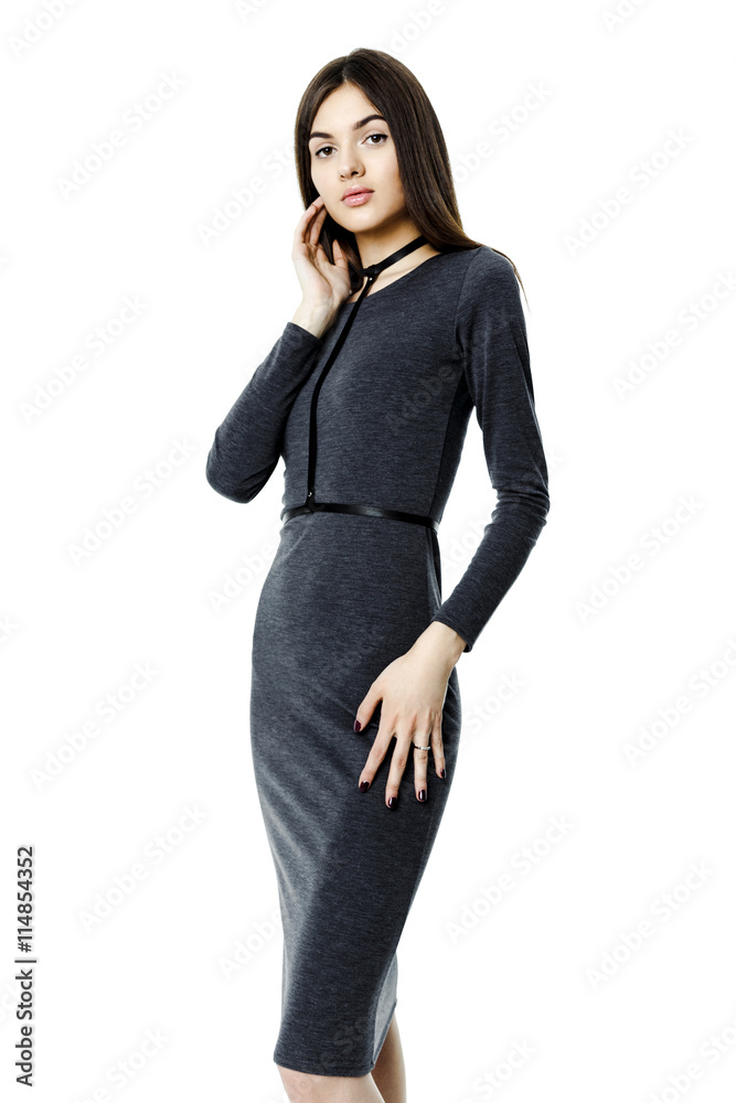 Attractive beautiful dark-haired woman wearing dress and belt on white background Attractive beautiful dark-haired woman wearing dress and belt on white background
