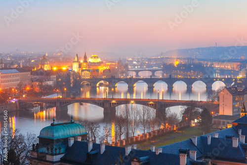 Aerial view of Old Town and bridges over Vltava River at night in Prague, Czech Republic