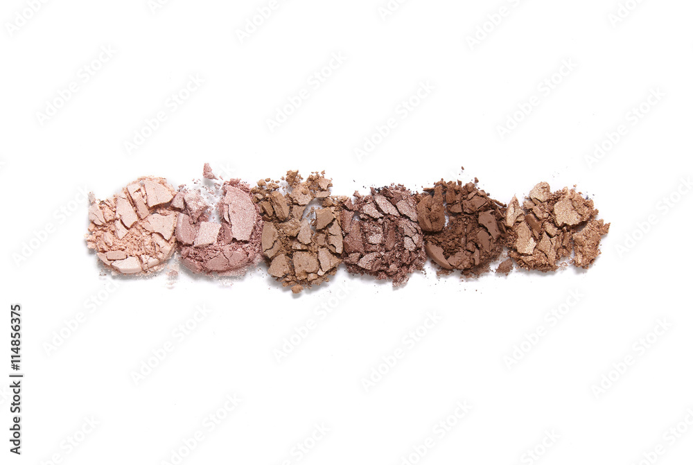 Obraz premium Broken neutral toned eye shadow palette isolated on a white background