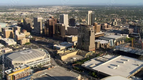 Flight past downtown Phoenix with view to distant mountains. Shot in 2007.