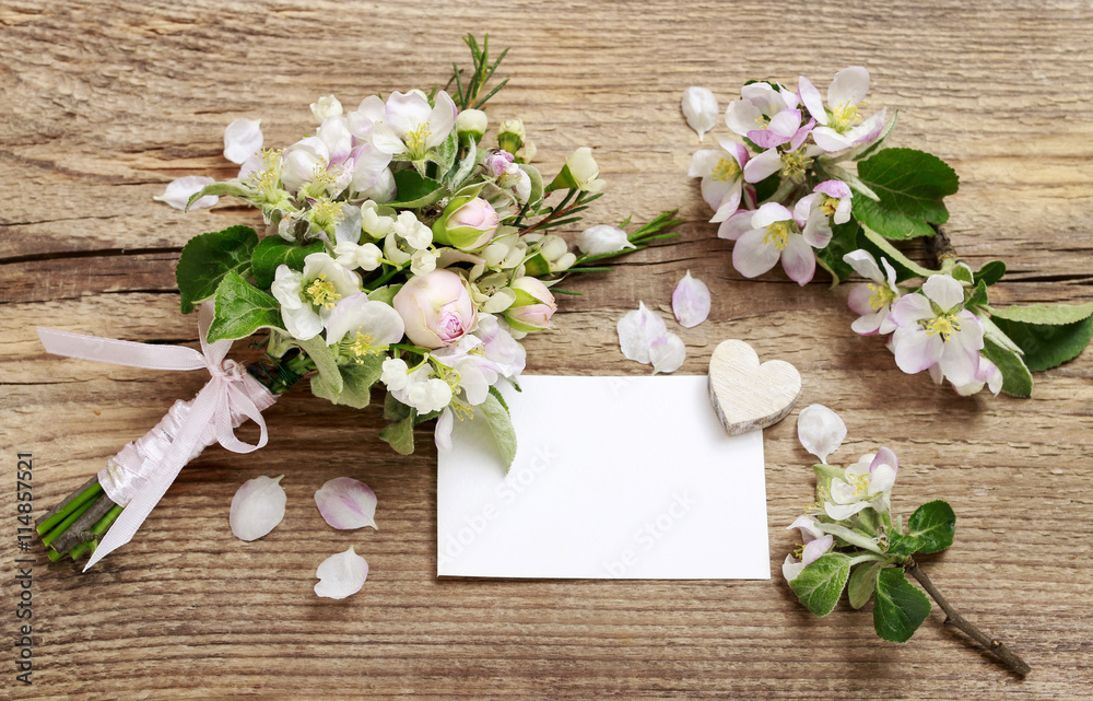 Romantic bouquet with flowering twigs of apple tree, lilly of th