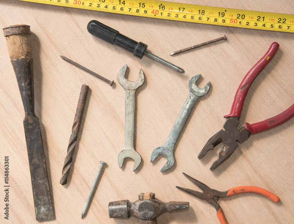 work tools hammer, wrench, screwdriver, pincers, on wood background work tools hammer, wrench, screwdriver, pincers, on wood background