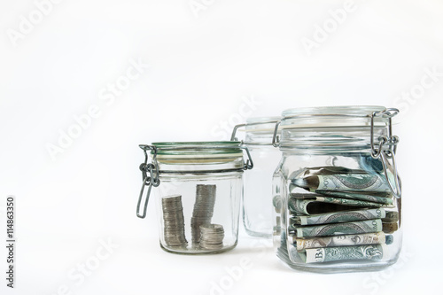 Money stored in sealed retro jars.