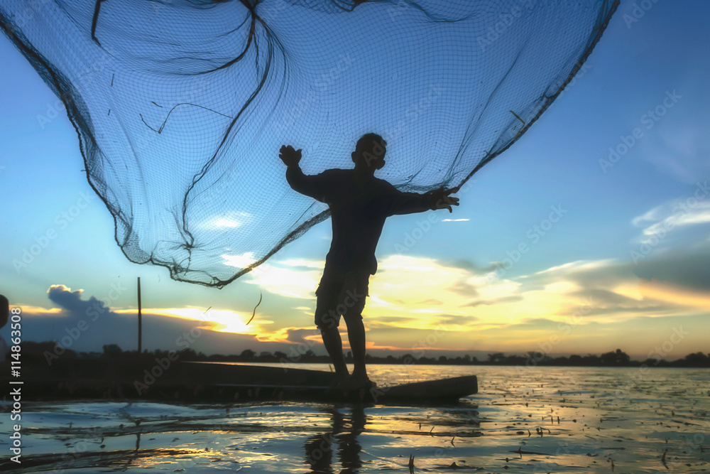 Traditional Asian fishermen throwing net fishing in the river at
